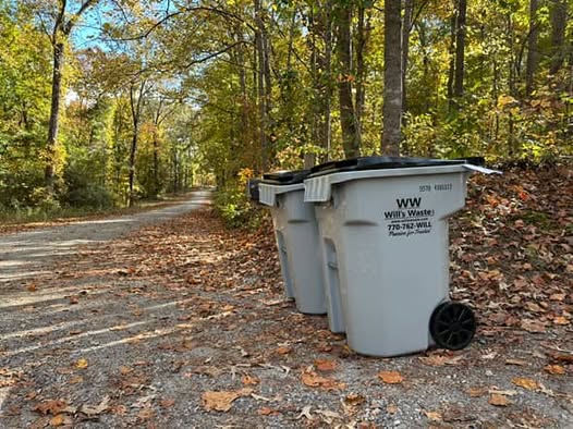Will's Waste residential trash containers staged for weekly curbside pickup